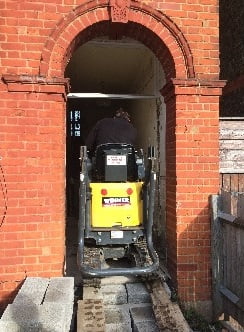 Digger through doorway