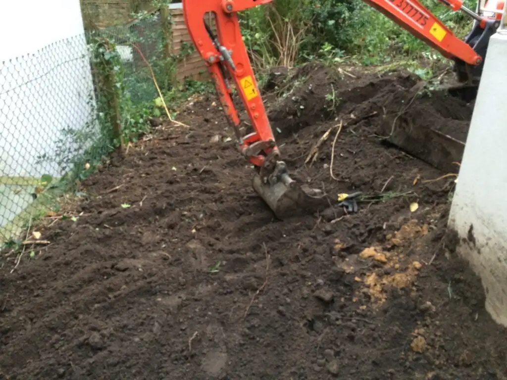 Japanese knotweed being dug out at a residential site in Highgate