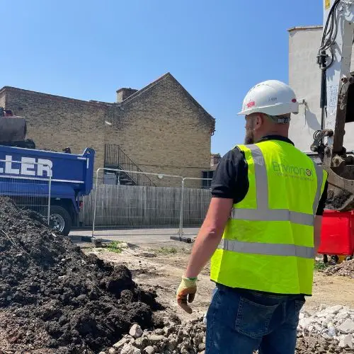 Controlled removal of Japanese knotweed - supervisor watching dig and dump
